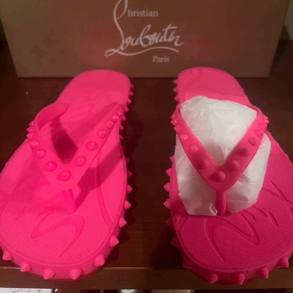 Christian Louboutin flip flops. Authentic. Including box. Hot pink color.